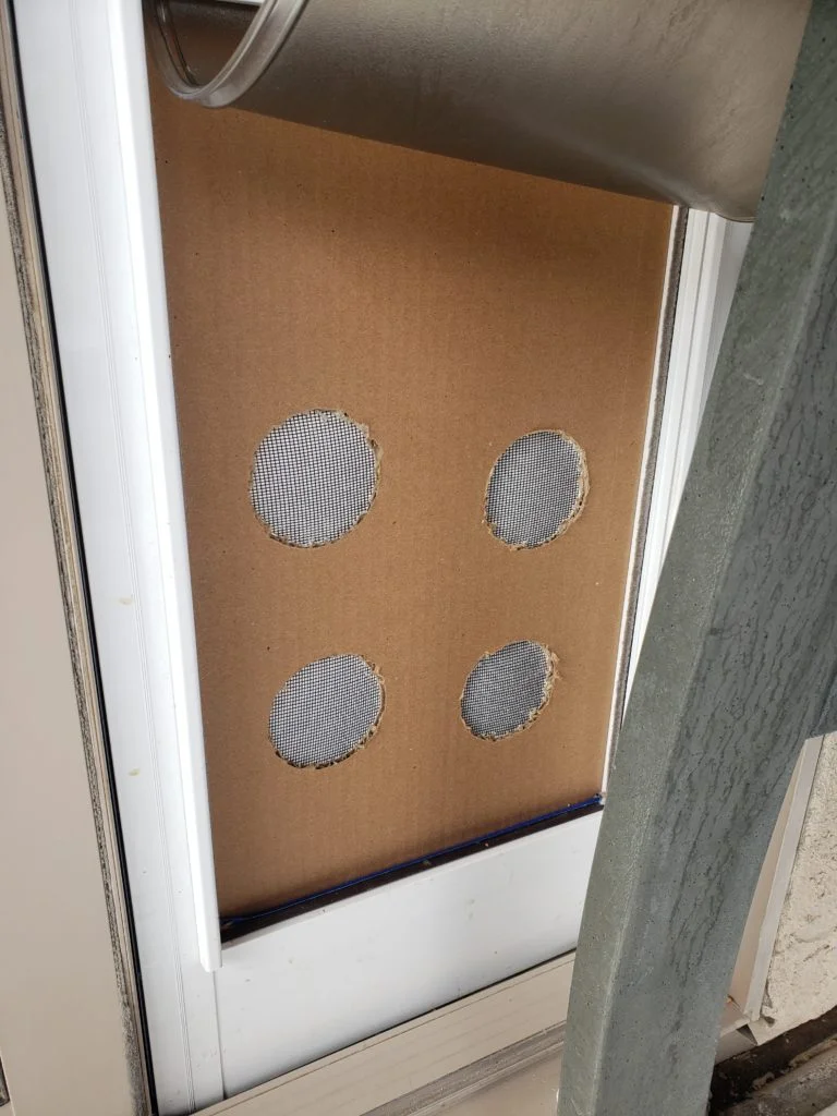 Test screen at the Evans Residence fully sealed after AeroBarrier application, with no holes or gaps visible